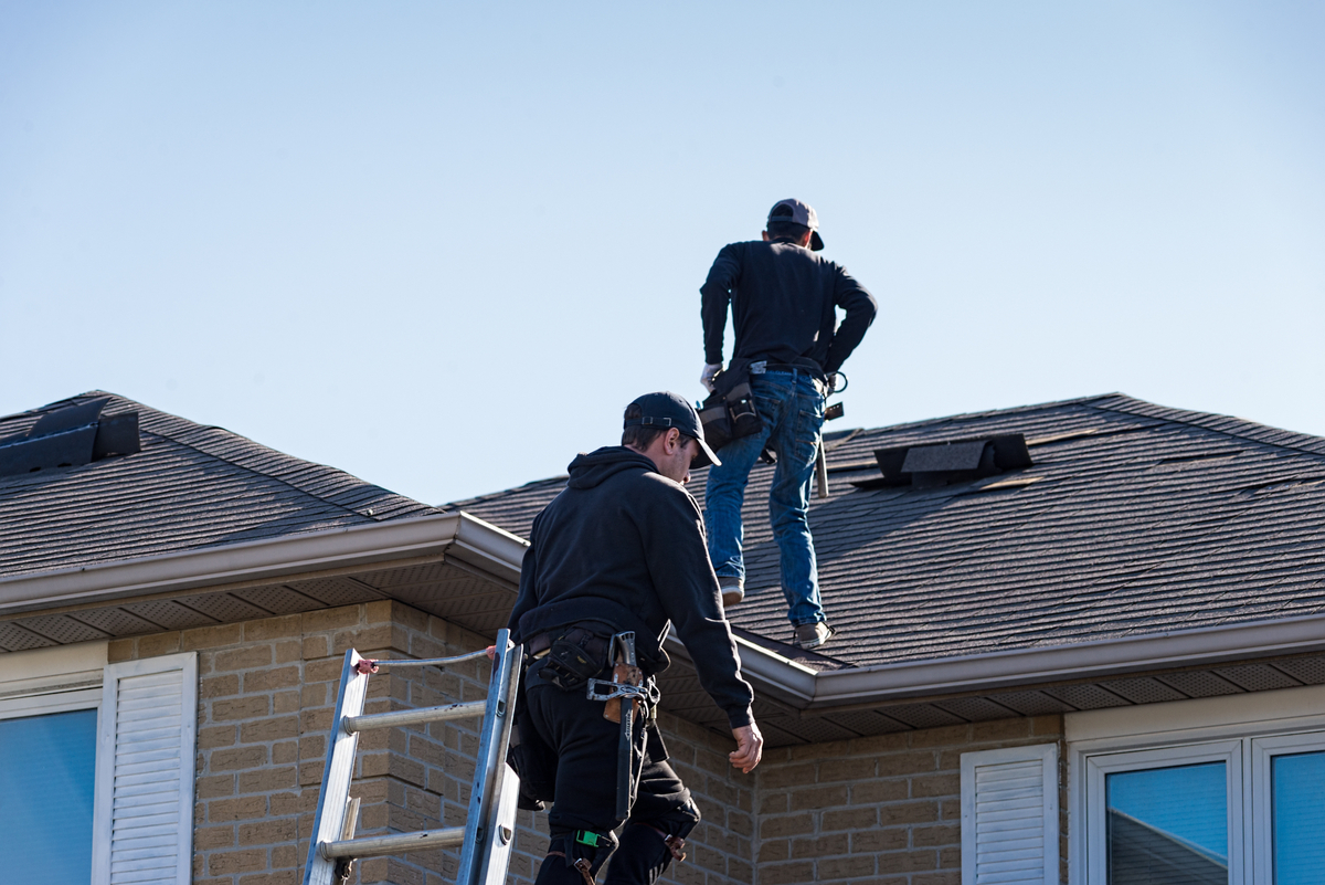 Houston roof experts inspecting roof before Brays Oaks roof replacement